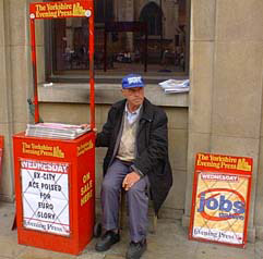 Newspaper man on the street