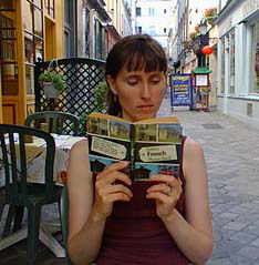 Kath consults the phrasebook