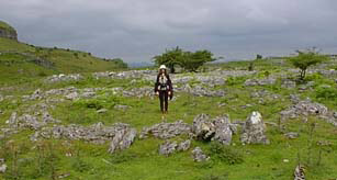 Kathleen in middle of ancient Hut foundation