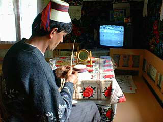 Weaving hats and watching the game